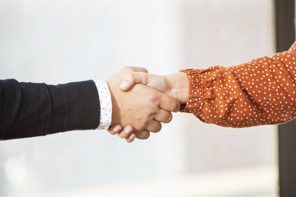 Close-up of business partners shaking hands